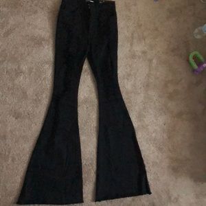 Black flare legged ripped jeans (Fashion Nova)